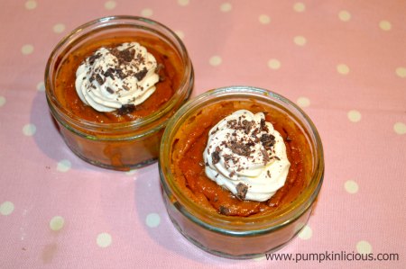 Two pumpkin desserts topped with cream