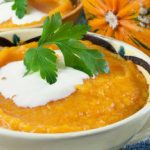 Creamy pumpkin soup with apple and sage