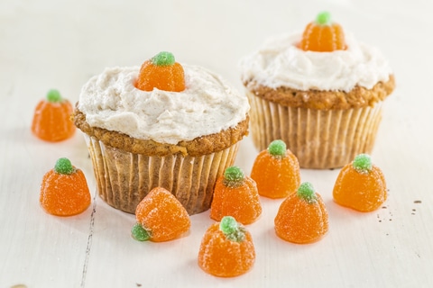 Pumpkin cupcakes decorated with mini pumpkin shaped candy